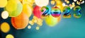 Happy New Year 2023. Christmas or New Year composition with rainbow numbers and Christmas rainbow ball. Festive background with Royalty Free Stock Photo