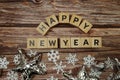 Happy New Year alphabet letter with Christmas accessories on wooden background Royalty Free Stock Photo