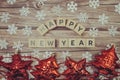 Happy New Year alphabet letter with christmas accessories on wooden background Royalty Free Stock Photo