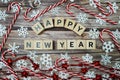 Happy New Year alphabet letter with christmas accessories on wooden background Royalty Free Stock Photo