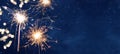 HAPPY NEW YEAR 2022 background banner greeting card - Firework, sparklers and bokeh lights and sparklers on dark blue night sky Royalty Free Stock Photo