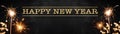 HAPPY NEW YEAR background banner panorama long greeting card - Firework, sparkling sparklers and bokeh lights on rustic dark black Royalty Free Stock Photo