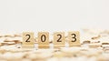 Happy New year 2023 background banner. Two thousand Twenty-Three year numbers on wooden blocks stack. wood blocks or square with n