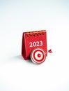 Happy new year 2023 background. 3d target icon with red 2023 year number desk calendar cover red color standing.