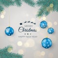 Happy New Year Background for Seasonal Greetings Cards and Banners. Blue Christmas Balls Hanging on Pine Branches Royalty Free Stock Photo