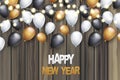 Happy New Year banner. Winter holiday design concept with golden, white and black balloons, wooden background with garland lights.