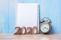2020 Happy New Year with blank notebook, retro alarm clock and wooden number. New Start, Resolution, Goals, Plan, Action and