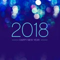 Happy new year 2018 with blue bokeh light sparkling on dark blue