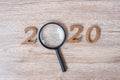 2020 Happy New year with Businessman holding glass magnifying and wooden number on table. New Start, Vision, Resolution, Strategy Royalty Free Stock Photo