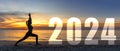 Happy new year card 2024. Silhouette lifestyle woman yoga practicing yoga standing as part of Number 2024 Royalty Free Stock Photo