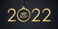 2022 Happy New Year celebrate banner with handwritten new year holiday greetings and gold christmas ball. Royalty Free Stock Photo