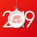 2019 Happy New Year celebrate card with handwritten holiday greetings and christmas ball. Hand drawn lettering. Royalty Free Stock Photo