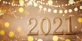 Happy New Year celebration background with golden numbers 2021 and Christmas decorations from lights and sparkles Royalty Free Stock Photo