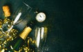 Happy New Year. Champagne bottle with two glasses,golden streamers,sparkling glitter and antique clock with copy space. New Years Royalty Free Stock Photo