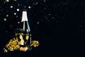 Happy New Year. Champagne bottle with two glasses,golden streamers and sparkling Glitter with space for text. New Years Eve Royalty Free Stock Photo