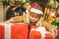 Happy new year. Child with big gift box. Christmas child holding a huge gift box. Little Santa Claus gifting gift Royalty Free Stock Photo