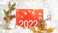 Blurred Christmas celebration. Number 2022 with lights. Xmas holiday composition.