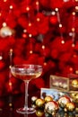 Happy New Year 2021. Christmas and New Year holidays red minimal background, winter season. A glass of champagne against a Royalty Free Stock Photo