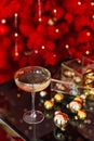 Happy New Year 2021. Christmas and New Year holidays red minimal background, winter season. A glass of champagne against a Royalty Free Stock Photo