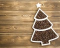 Happy New Year 2023. Christmas pine nuts in saucers in the form of a Christmas tree. Christmas wooden Royalty Free Stock Photo