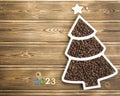 Happy New Year 2023. Christmas pine nuts in saucers in the form of a Christmas tree. Christmas wooden Royalty Free Stock Photo