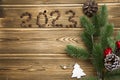 Happy New Year 2023. Christmas pine nuts in saucers in the form of a Christmas tree. Christmas wooden Royalty Free Stock Photo