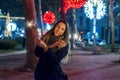 Happy New Year. Close up of woman holding sparkler on the street Royalty Free Stock Photo