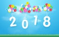Happy new year 2018 with Colorful balloons flying over grass. Paper art and craft style