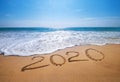 Happy New Year 2020 is coming concept sandy tropical ocean beach lettering. Exotic New Year celebration concept image Royalty Free Stock Photo