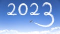 Happy New year 2023 concept. cloud drawing by airplane in sky