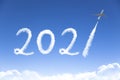 Happy New year 2021 concept. cloud drawing by airplane in sky Royalty Free Stock Photo