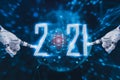 Happy new year 2021,concept digital trends,robot hand touch icon,is full modernity advanced technology,artificial intelligence or Royalty Free Stock Photo