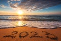 Happy New Year 2023 ocean sunrise on the beach sand concept Royalty Free Stock Photo