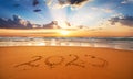 Happy New Year 2023 concept, lettering on the beach. Written text on the sea beach at sunrise