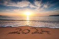 Happy New Year 2024 concept, lettering on the beach. Written text on the sea beach at sunrise