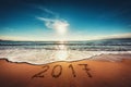 Happy New Year 2017 concept on the sea beach; sunrsie shot Royalty Free Stock Photo