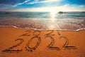 Happy New Year 2022 concept on the sea beach; sunrsie shot