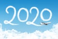 Happy New year 2020 concept travel on the background below cloudscape. Drawing by passenger airplane vapor contrail in sky