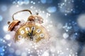 Happy New Year concept, vintage alarm clock in the snow shows 2020, greeting card with copy space Royalty Free Stock Photo