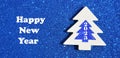 Happy new year 2023 concept.White christmas tree with number on gllitter blue background. Winter holidays. Royalty Free Stock Photo