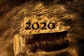 Happy New Year 2020. Creative Collage of numbers two and zero made up the year 2020. Beautiful sparkling Golden number 2020 on Royalty Free Stock Photo