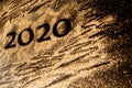 Happy New Year 2020. Creative Collage of numbers two and zero made up the year 2020. Beautiful sparkling Golden number 2020 on Royalty Free Stock Photo