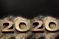 Happy New Year 2020. Creative Collage of numbers two and zero made up the year 2020. Beautiful sparkling Golden number 2020 on Royalty Free Stock Photo