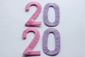 Happy New Year 2020. Creative text Happy New Year 2020 written sparkling sparklers isolated on black background for design. Royalty Free Stock Photo