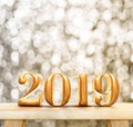 Happy New Year 2019 3d rendering gold glossy on modern wood ta