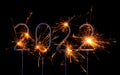 Happy New Year 2022. Digits of year 2022 made by burning sparklers isolated Royalty Free Stock Photo