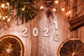 Happy New Year festive background with golden numbers 2020 2021 on vintage wooden table top view Royalty Free Stock Photo