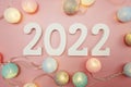 Happy New Year 2022 festive background with space on pink background Royalty Free Stock Photo