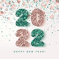 2022 Happy New Year festive Banner with glowing rose gold and emerald Numbers on falling geometric foil paper confetti background