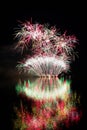 Happy New Year 2018 Firework. Beautiful colorful fireworks on the water surface with a clean black background. Royalty Free Stock Photo